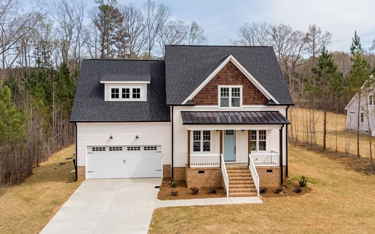 Beautiful new craftsman-style house with front porch and attached garage in NENC.